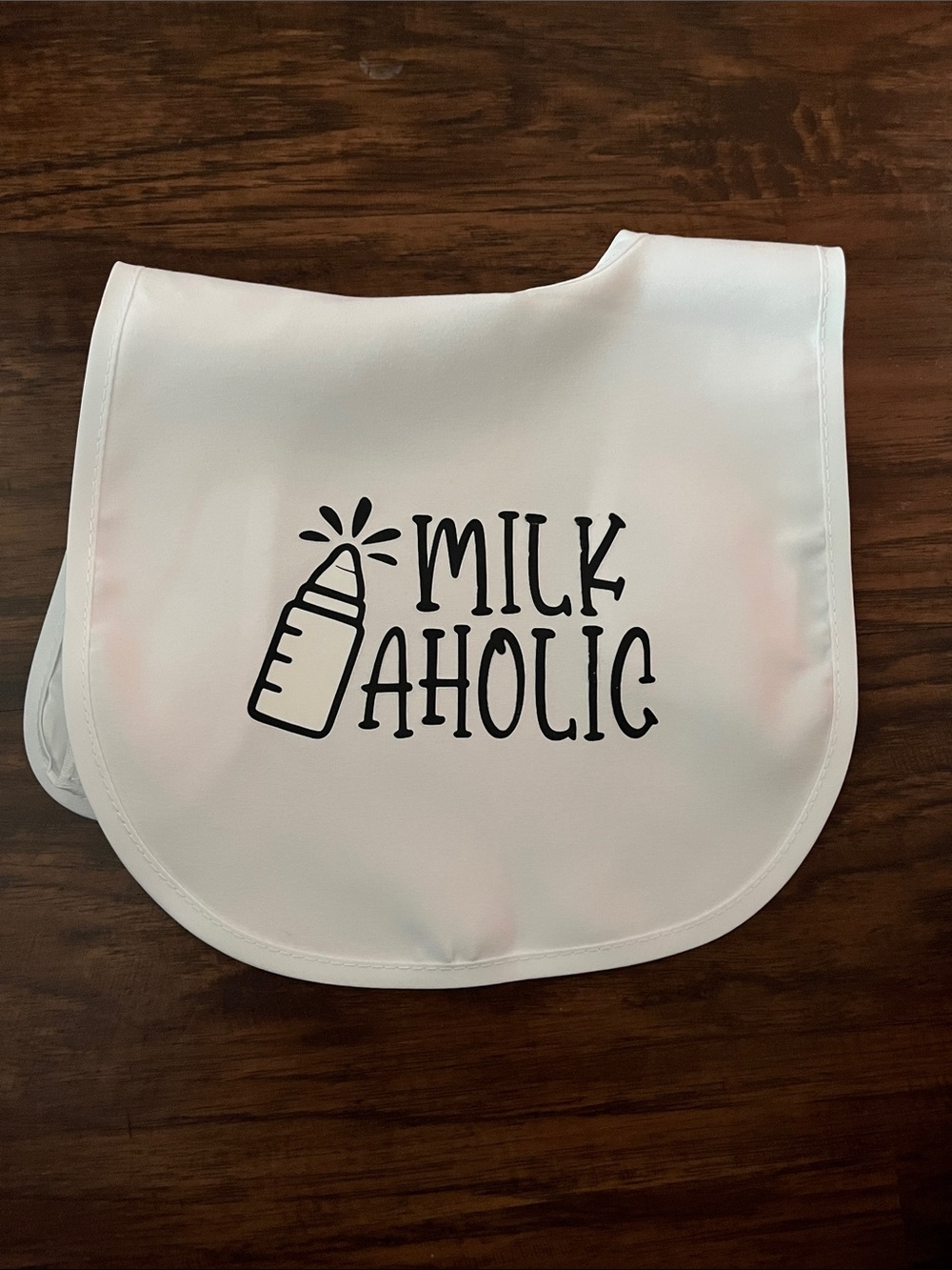 White Baby Bib with "Milkaholic" Black Print